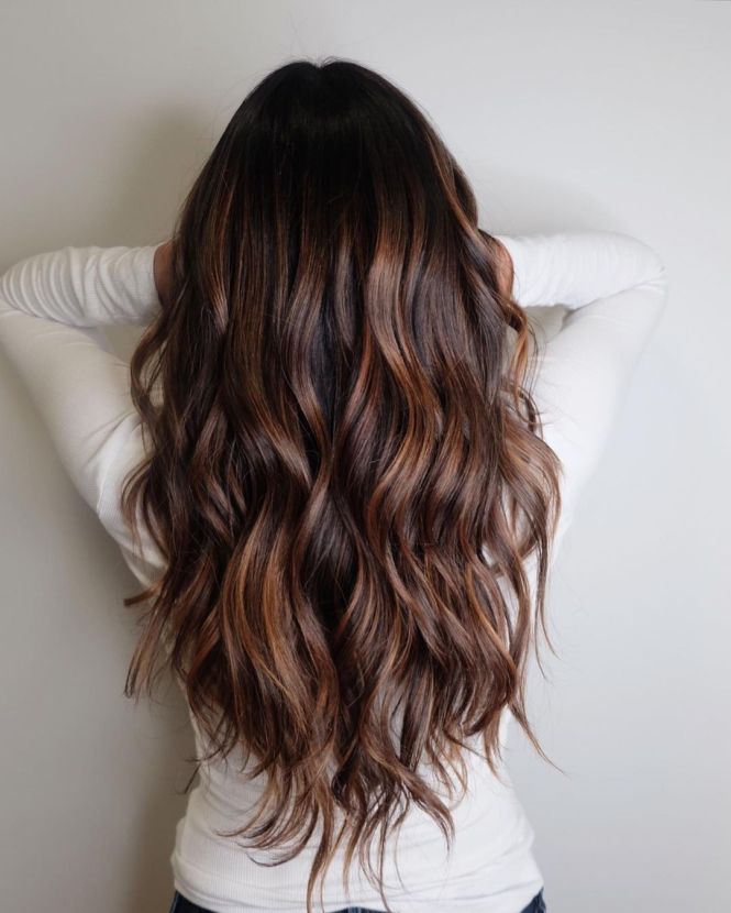 Beachy layers giving natural waves for a casual, sun-kissed style.