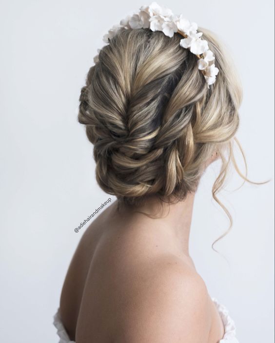 Halo braids encircling the head, creating a regal and bohemian look.