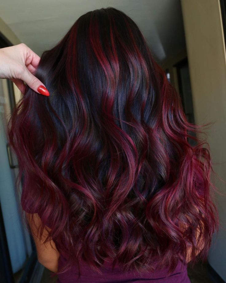 Stand out with bright burgundy red hair. Perfect for half updos, this vivid color contrasts beautifully with your roots in waves, curls, or straight strands.