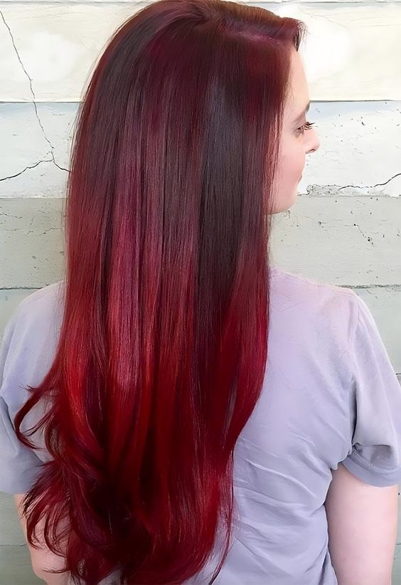 Show off your burgundy purple hair with a sleek, silky blowout. Achieve a glossy and smooth finish that lets the vibrant hair dye shine brilliantly.