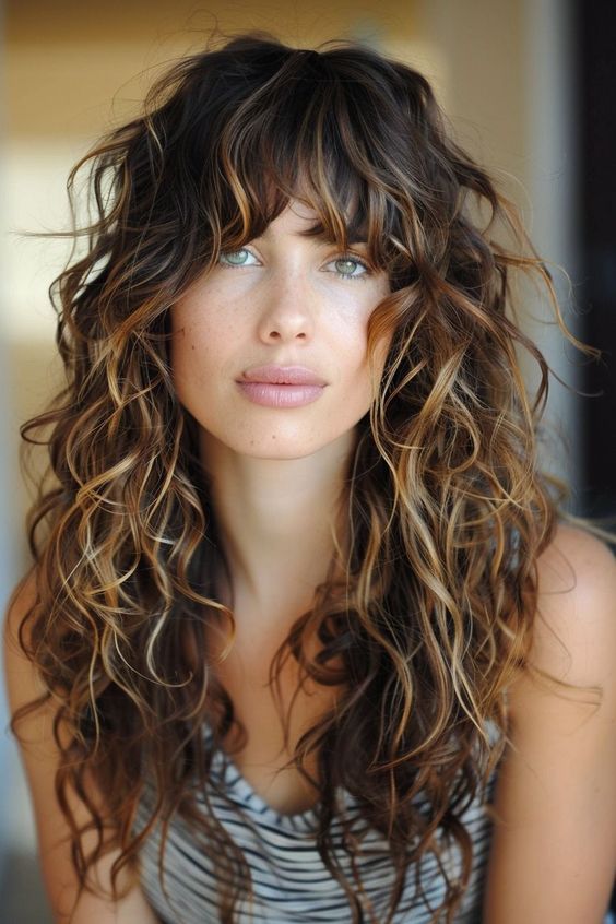 Woman with curly haircuts & hairstyle bangs