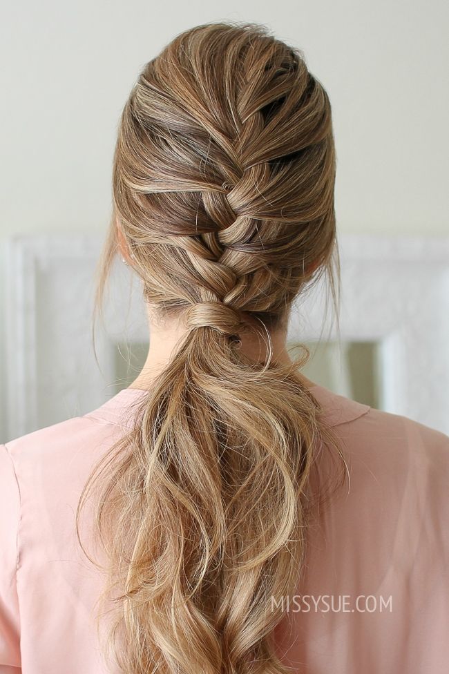 Elegant French braid ponytail starting from the crown and flowing into a sleek, low ponytail.