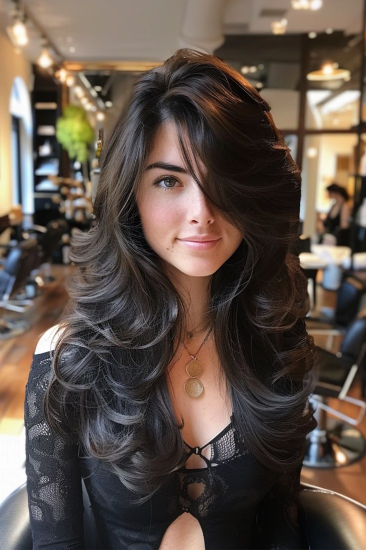 Layered haircut with highlights enhancing dimension and color.