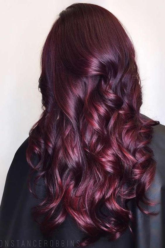 Draw attention with a magnetic plum burgundy hair color. Perfect for creating charming curls and adding texture and dimension to your locks.