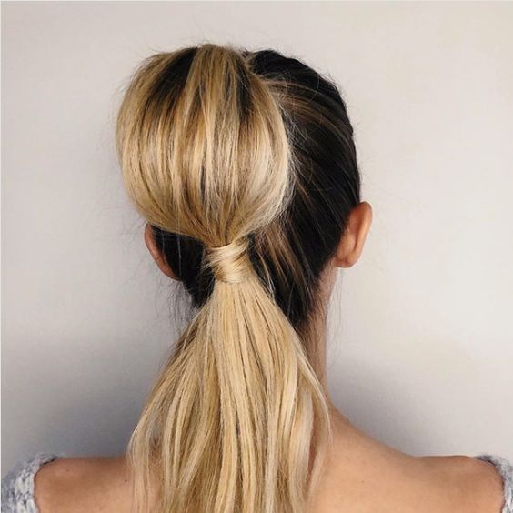 Bold big bubble ponytail with large, evenly spaced bubbles for a dramatic and playful look.