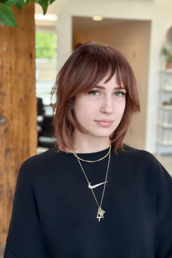 Woman with shaggy bob and bangs