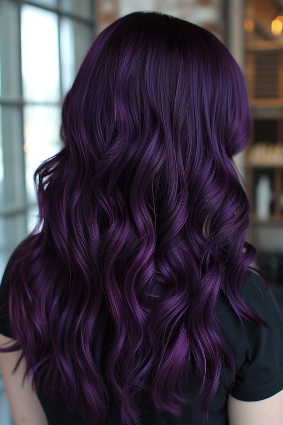 Show off medium-length layered hair with a beautiful plum shade. Whether straight or wavy, this burgundy hair color style is stunning.