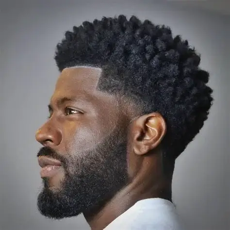 Black man with a high fade haircut.