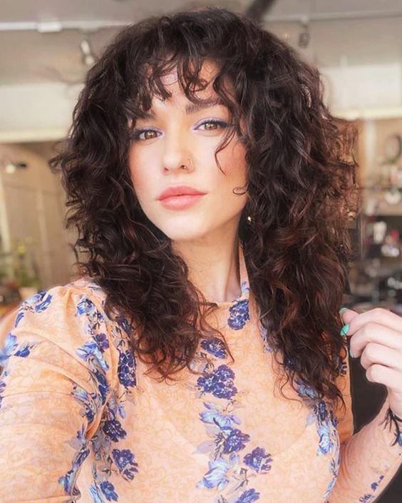 Wolf cut curly wig with textured curls and voluminous layers