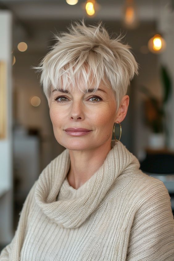 Chic blonde pixie hairstyle for women over 50 offering a bright and youthful look.