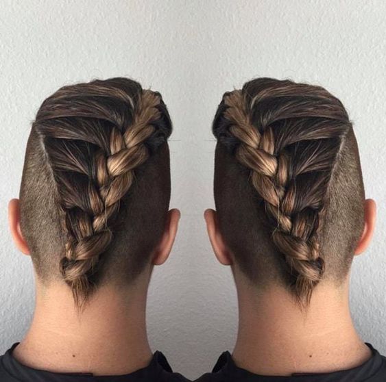 Man with a braided Mohawk including intricate braids running along the top.