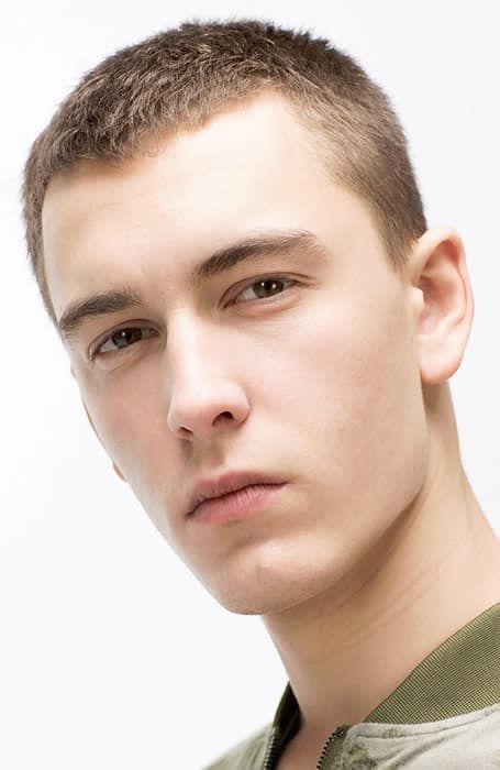 Buzz cut hairstyle offering a balanced look for a long face.