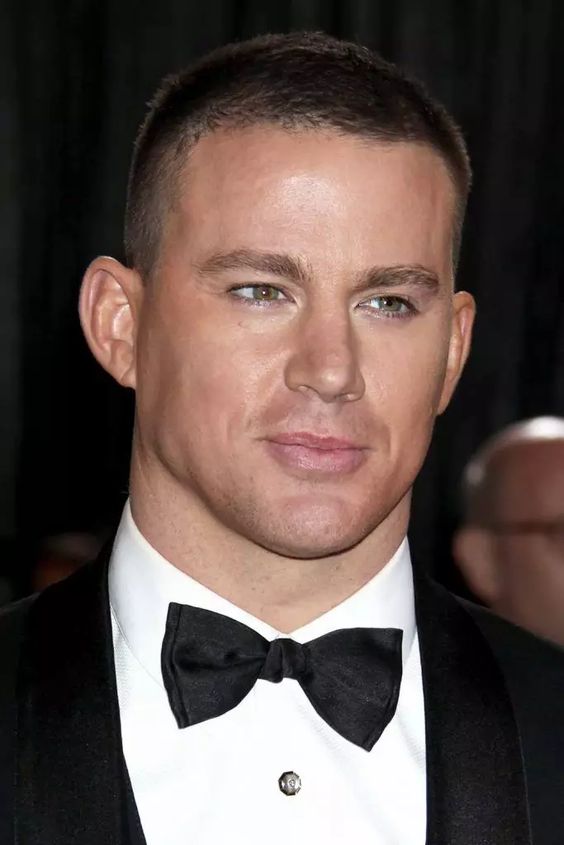 Man with a buzz cut, a low-maintenance hairstyle for summer.