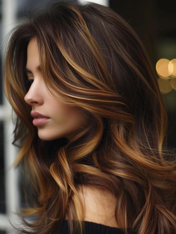 Woman with caramel highlights in brunette hair