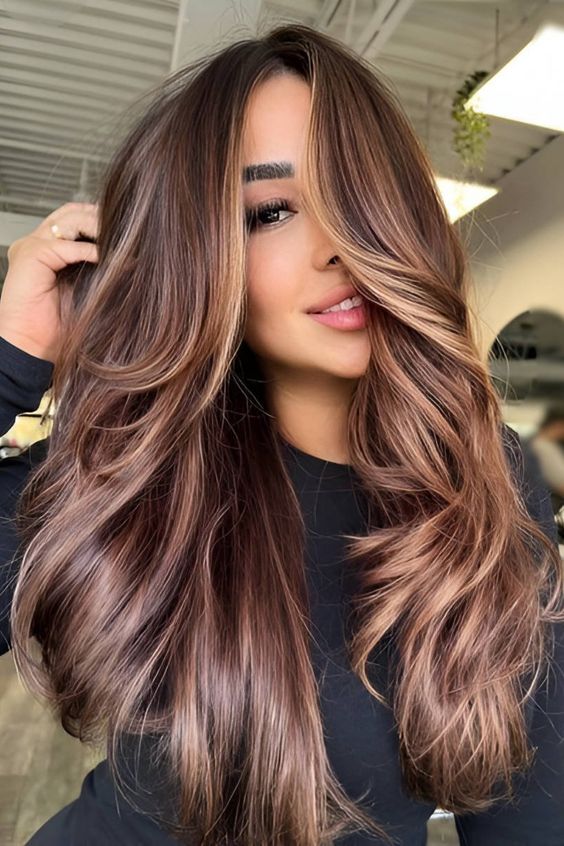 Bold caramel streaks in dark hair