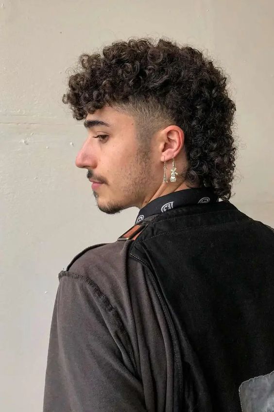 Curly hair mullet with natural curls and traditional mullet shape