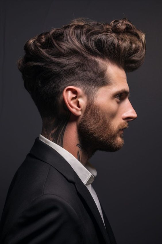 Curly pompadour for men, with curls styled upwards and back for a voluminous look.