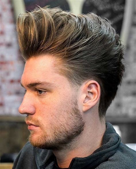 Man with a pompadour hairstyle, a classic voluminous look for summer.