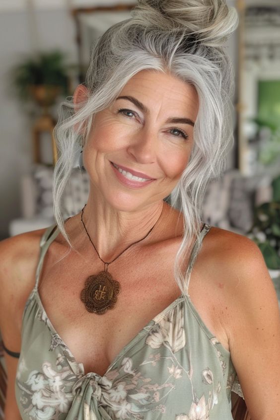 Sophisticated silver updo gray hairstyle for women over 70