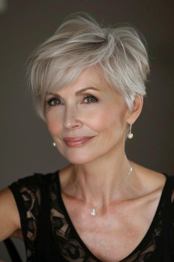 Tapered pixie gray hairstyle for women over 70.