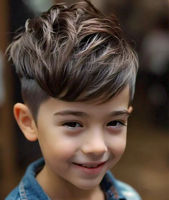 Boy with an undercut hairstyle featuring a defined side part.